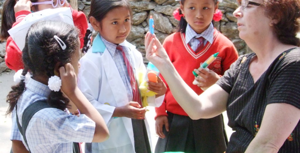 Denise Bergman with school children in Nepal