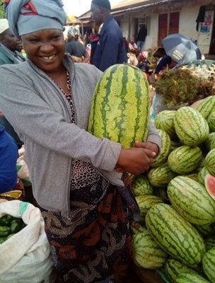 Scholastika (one of our most recent recipients) at her watermelon stall.